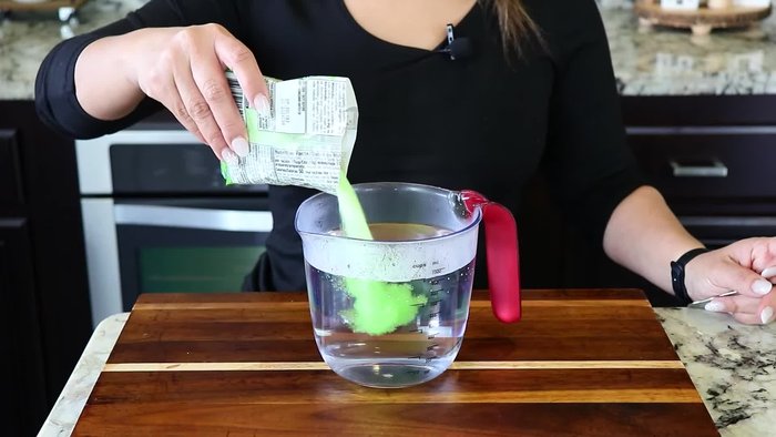 Prepare the Jello: Add boiling water to both lime and strawberry Jello mixes. Stir until completely dissolved. Transfer to separate baking dishes and let cool.