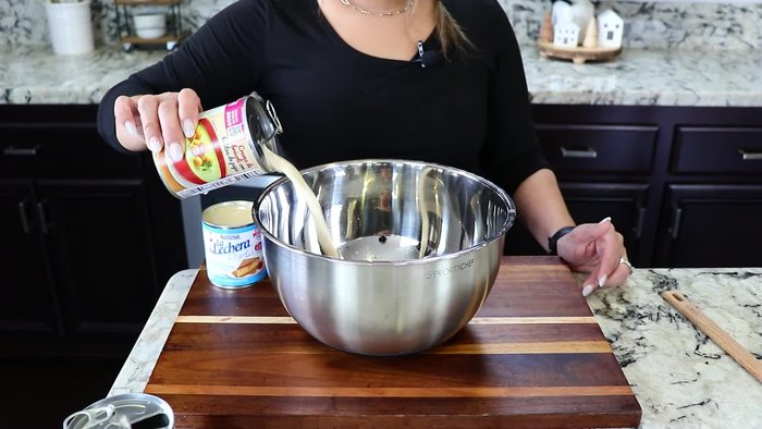 Prepare the creamy Jello: In a mixing bowl, combine evaporated milk and sweetened condensed milk. Mix until well combined.