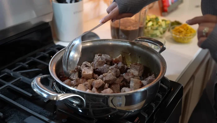 Fry the meat: Once the water has evaporated, fry the meat for about 10 minutes. Remove bay leaves.