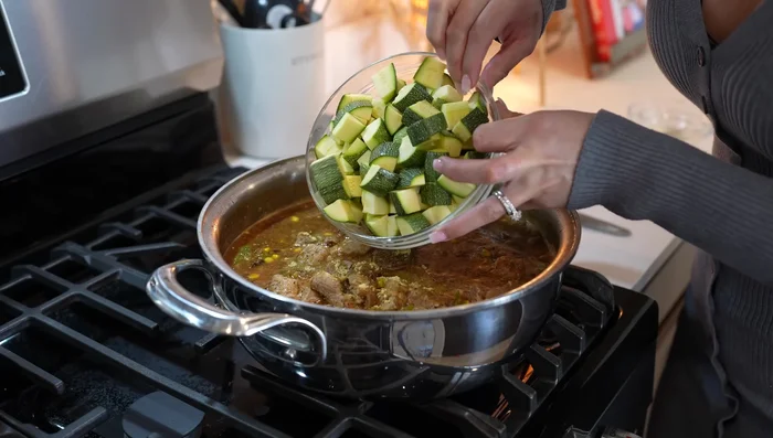 Add chicken bouillon and calabacitas. Simmer for 7-10 minutes, until calabacitas are cooked and meat is tender.