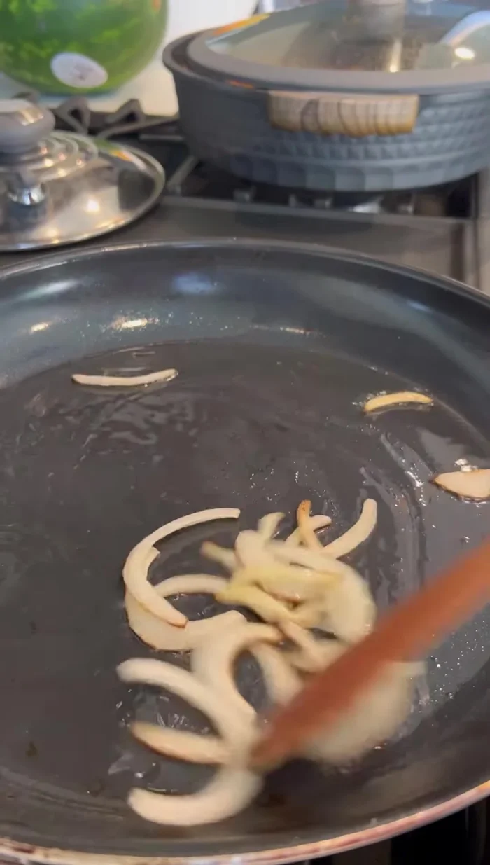 Prepare the beans for garnish by cooking them with a little onion, mashing them, and seasoning to taste.