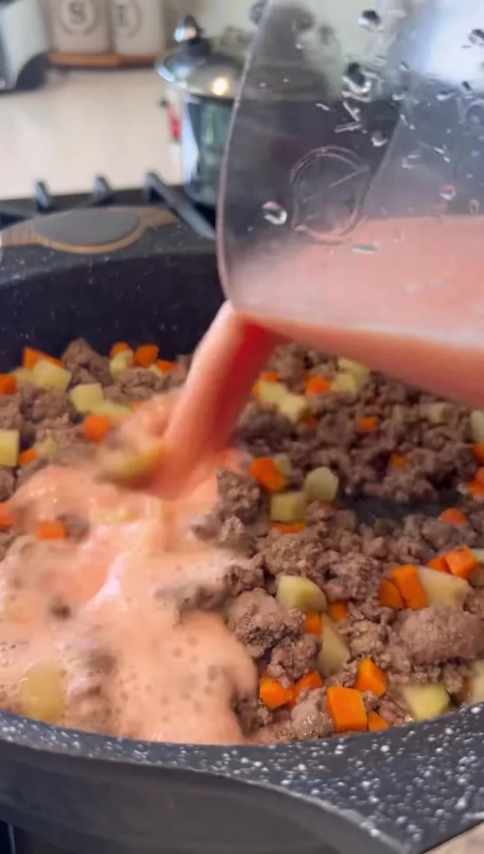 Add the blended tomato mixture to the meat and simmer until the tomato cooks. Season to taste.