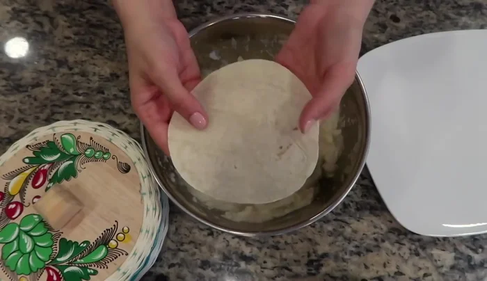 Warm corn tortillas to prevent tearing. Fill each tortilla with about two tablespoons of the potato mixture, fold, and gently distribute the filling.