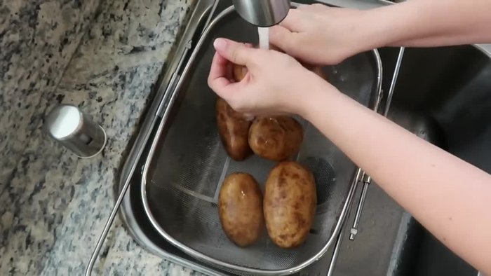 Wash and peel russet potatoes. Cut into smaller pieces for faster boiling.
