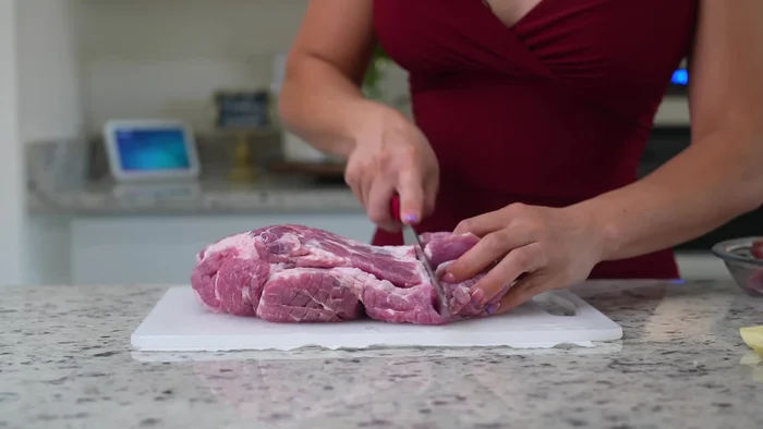 Cut the pork shoulder into 2-inch cubes.
