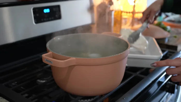 Shred cooked chicken and reserve 2 cups of broth.
