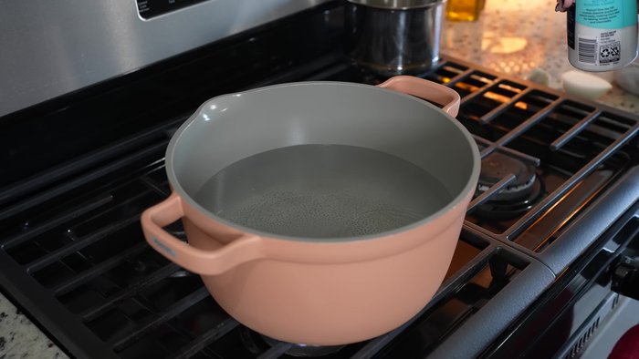 Boil chicken with salt, garlic, and half an onion.