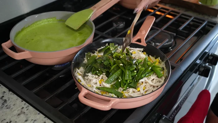 Add poblano pepper strips and 1 cup of poblano sauce to the chicken mixture. Mix well.