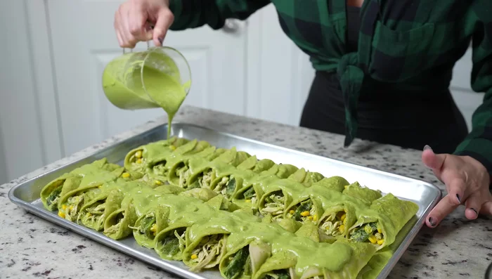 Top enchiladas with remaining sauce and cheese. Bake for 15 minutes until cheese is melted.