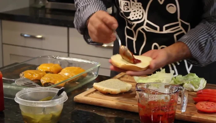 Prepare the bottom bun by spreading your ketchup-chipotle mixture on it.