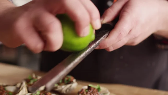 Garnish with cilantro and lime zest.