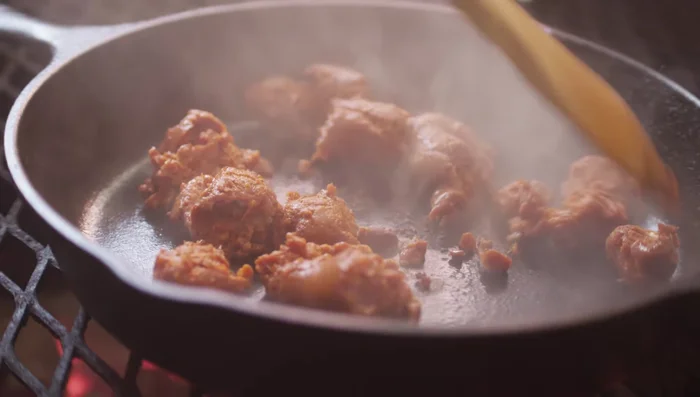 Add 6 ounces of Mexican chorizo to the skillet and cook until browned and cooked through. Slide the chorizo off the direct heat once cooked.