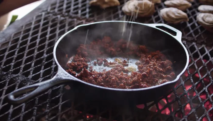 While oysters grill, prepare the chorizo butter: In a separate pan, combine the juice of one lime, 1 teaspoon of carne asada seasoning, and 6 ounces of butter (smoked butter recommended). Stir until the butter is melted and the lime juice is reduced.