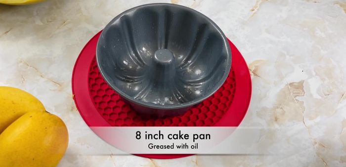 Pour the batter into a greased baking pan. Bake at 118°C (244°F) for 30-35 minutes, or until a toothpick inserted into the center comes out clean.