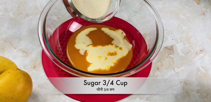 In a large mixing bowl, combine sugar and oil. Beat well for about 2 minutes.