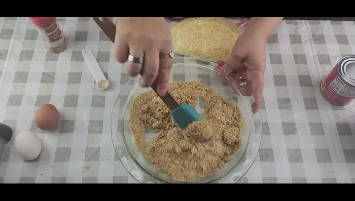 Press the mixture into a pie dish to form the crust.