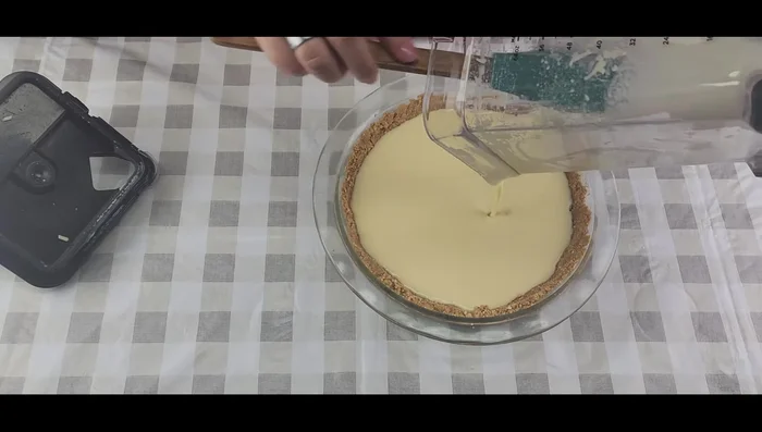 Pour the cheese mixture over the crust.