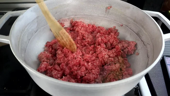 Brown 1 ¾ pounds of ground beef (or 1 ½ pounds). Season with salt and pepper.