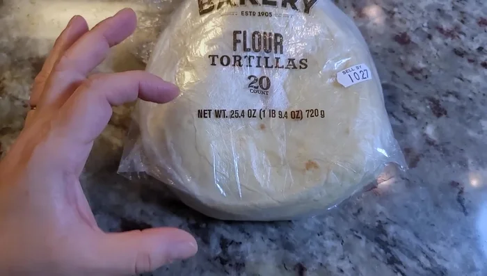 Heat the oil in the pan for frying tortillas. Check the temperature by inserting a wooden spoon; it should bubble around the handle (around 350°F).