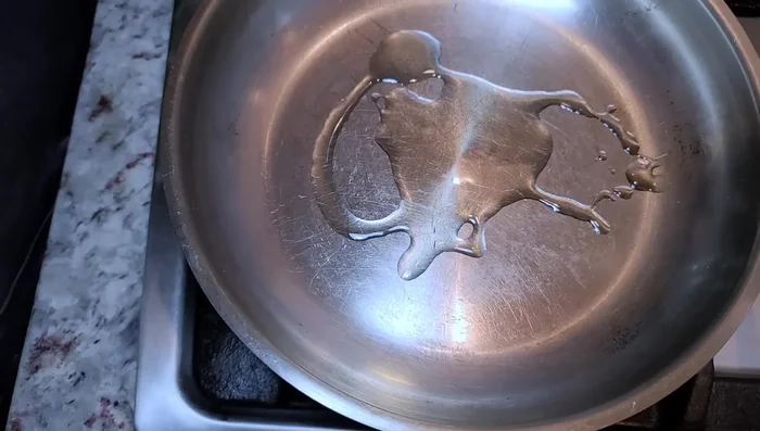 Add 1 pound of lean ground beef to the pan. Break it apart.