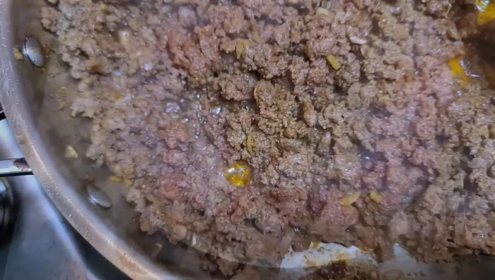 Cook the ground beef until done. Taste and adjust seasoning with salt as needed. Set aside.