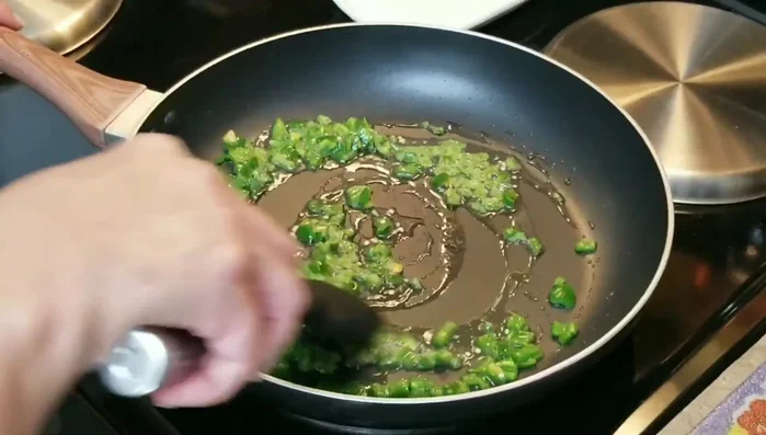 Stir the peppers for 1 minute to release their flavor.