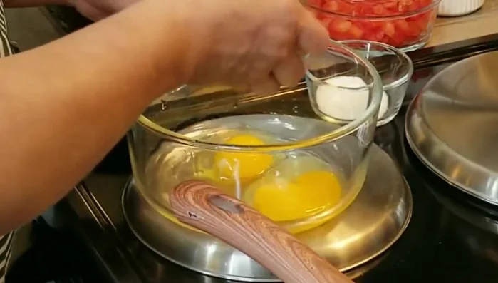 In a bowl, beat 6 extra-large eggs with salt.