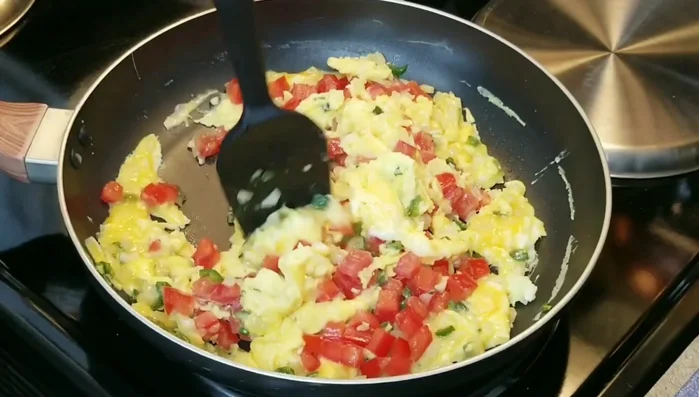 Fold the eggs to combine, ensuring they are not overcooked.