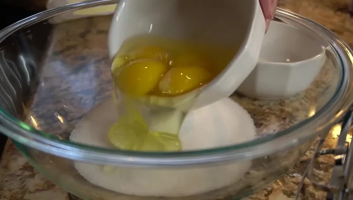 In a separate bowl, combine sugar, eggs, Mexican vanilla blend, vegetable oil, and butter; mix well.