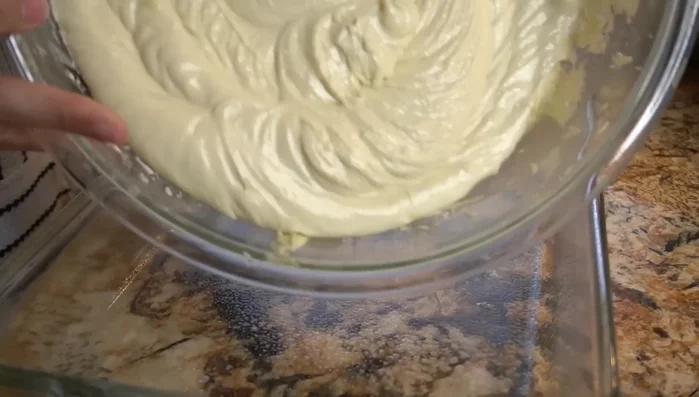Pour batter into the prepared baking dish and spread evenly.
