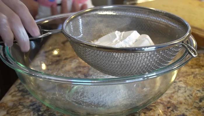 Sift powdered sugar into a bowl.
