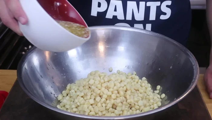 Drizzle melted butter over the corn.