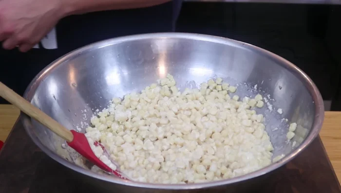 Add more Cotija cheese and mayonnaise as needed to reach desired thickness. It will thicken further upon chilling.