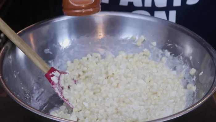 Season with Tajin seasoning, a little at a time.