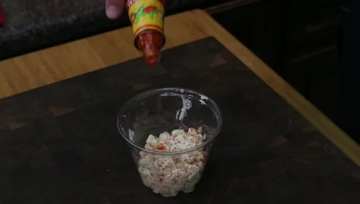 Top with more Tajin, hot sauce, and cilantro.