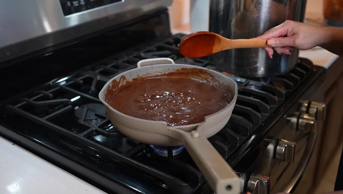 Simmer the sauce for 10 minutes; taste and adjust seasoning. Shred the pork if desired.