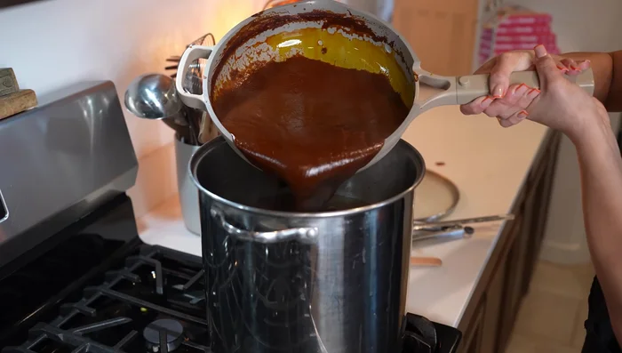 Combine the shredded pork and chili sauce. Continue to cook for 20-30 minutes.