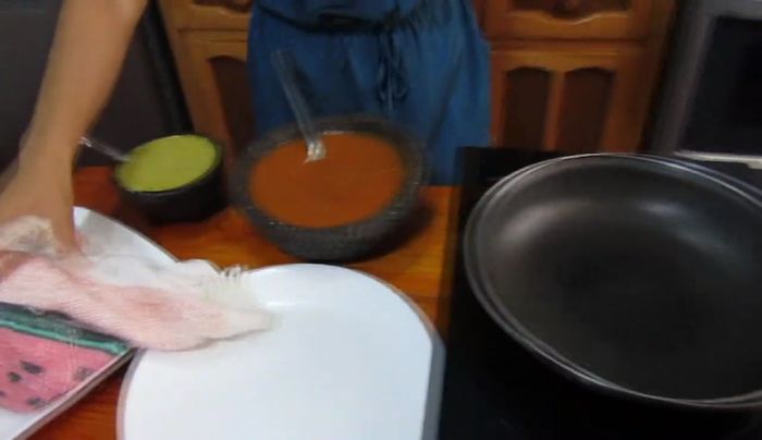 Brown the tortillas: Lightly brown the tortillas in a pan with oil or lard until golden.