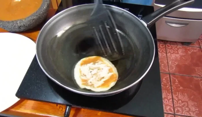 Warm the chalupitas: Warm the assembled chalupitas on a griddle.