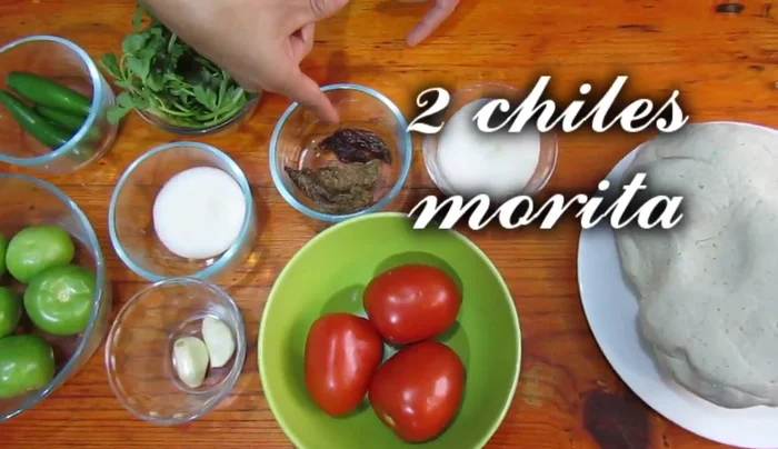 Prepare the red sauce: Blend tomatoes, chipotle chiles, morita chiles, onion, and garlic. Add salt to taste.