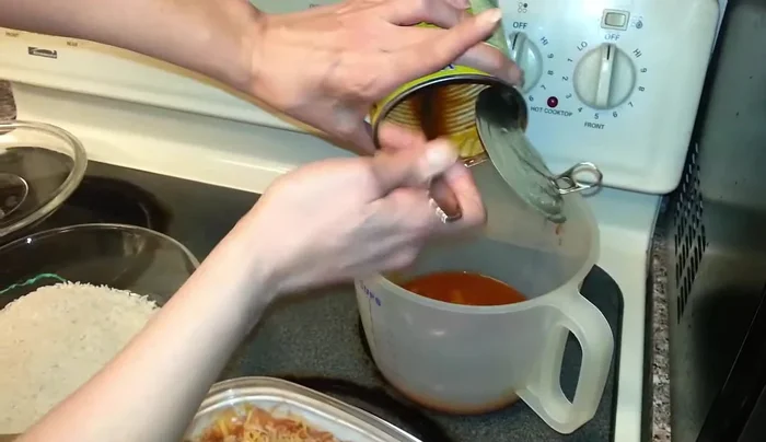 Pour the liquid mixture into a microwave-safe casserole dish containing 2 cups of white rice.