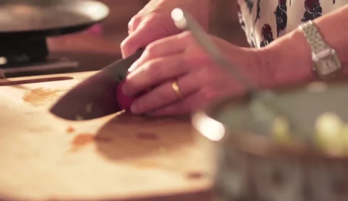 Add diced radishes to the vinaigrette mixture.
