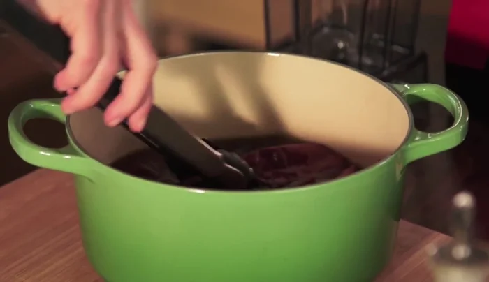 Rehydrate the toasted chiles in hot water for about 15 minutes.