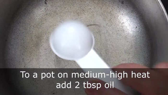 Heat 2 tablespoons of oil in a pot over medium-high heat.