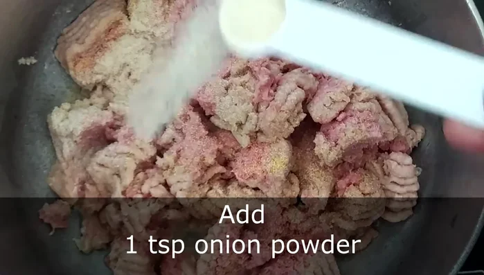 Add 0.5 teaspoon of garlic powder, 1 teaspoon of onion powder, 1 teaspoon of salt, 1 teaspoon of dried cilantro, 1 teaspoon of chili powder, 0.5 teaspoon of black pepper, 0.5 teaspoon of cumin, and 0.5 teaspoon of paprika.