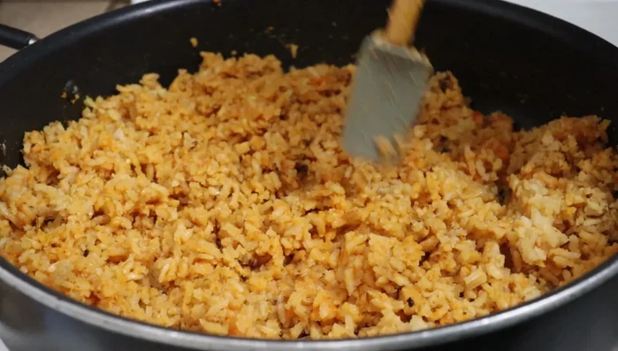Fluff the rice with a spatula and serve.