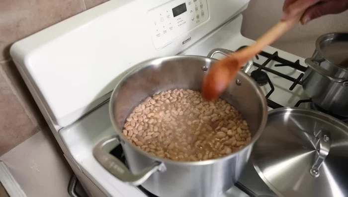 After an hour and three minutes, add more water to just cover the beans.