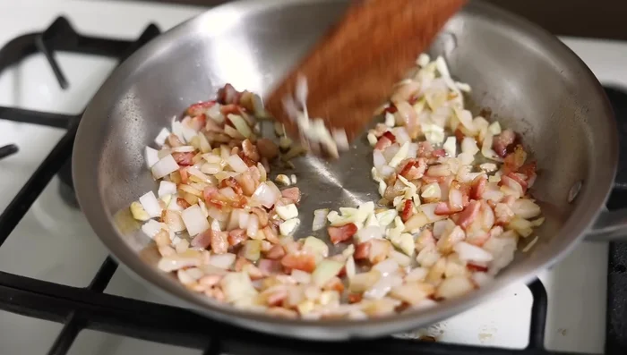 Add garlic to the skillet and cook until lightly toasted.
