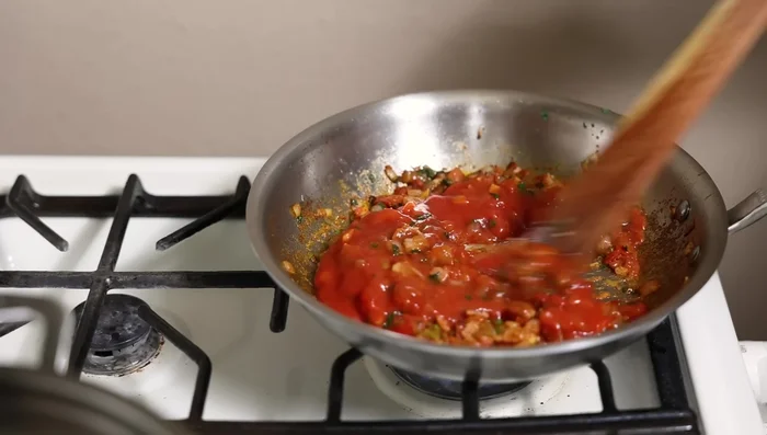 Stir in tomato sauce until heated.