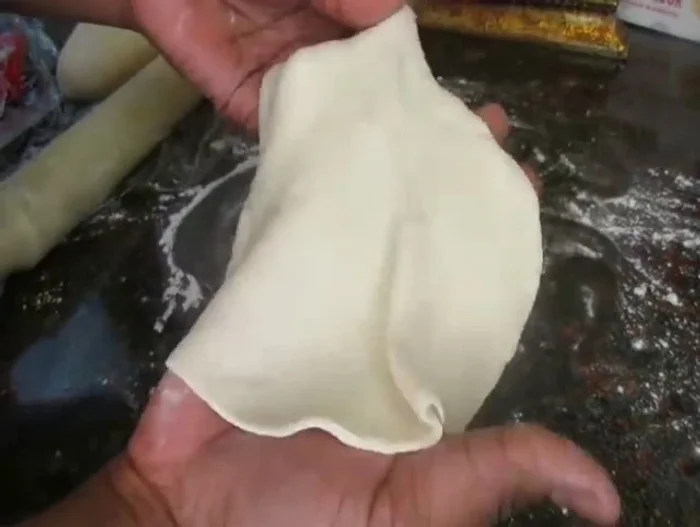 Stretch the dough circles slightly.